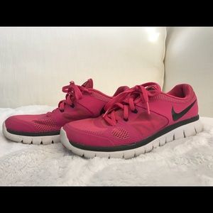 Pink Nike running shoes